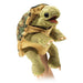 Plush turtle toy on a mannequin arm with a white background