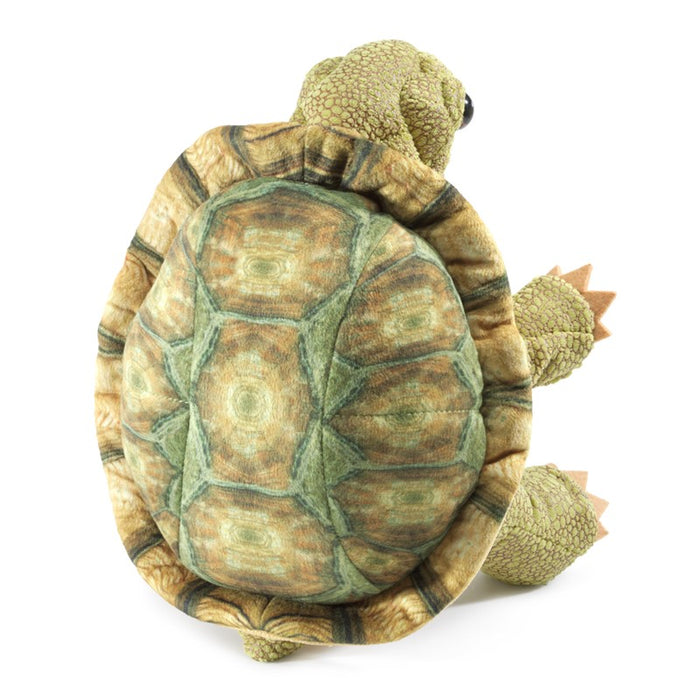 Plush turtle toy with detailed shell on a white background