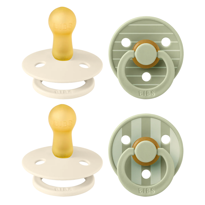 Two pairs of baby pacifiers in beige and green on a white background