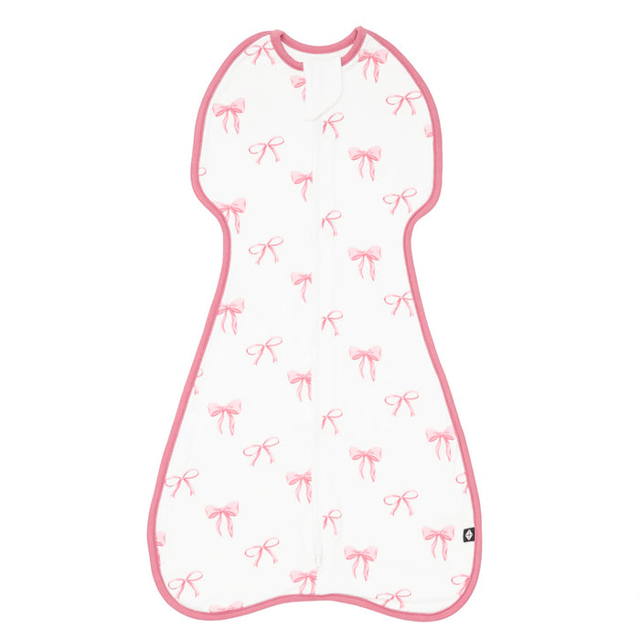 Baby sleeping bag with pink bow pattern on a white background
