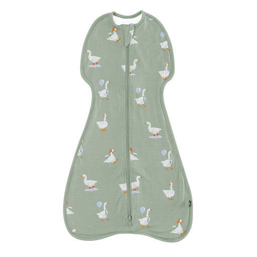 Green baby sleeping bag with duck pattern on a white background