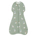 Green baby sleeping bag with duck pattern on a white background