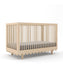 caption-Oeuf Modern Nursery Crib  - Moss features a wave motif and airy wooden spindles