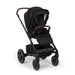 Black stroller with canopy on a white background