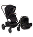 Black Nuna Mixx Next Stroller with Black Pipa Infant Car Seat in Caviar Black and Chocolate Brown Accents against a white background