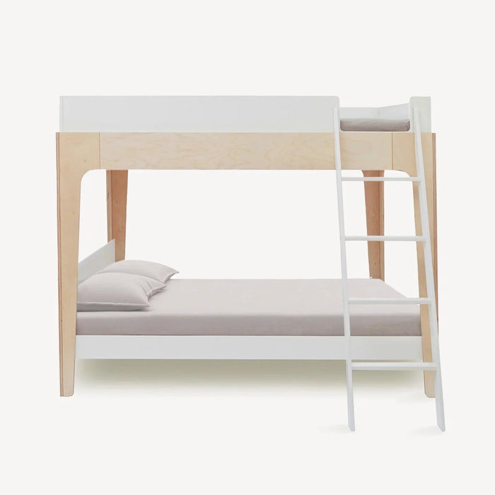 A modern bunk bed frame with a light natural wood finish and white-painted rails and ladder, shown with bedding on a solid off-white background.