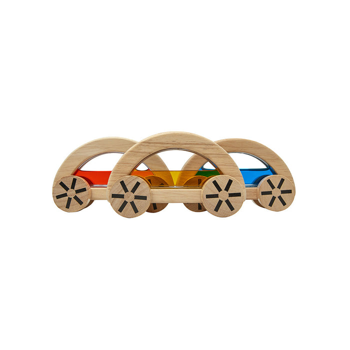 Wooden toy cars with colourful pane on a white background