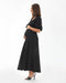 Woman wearing a black dress on a white background