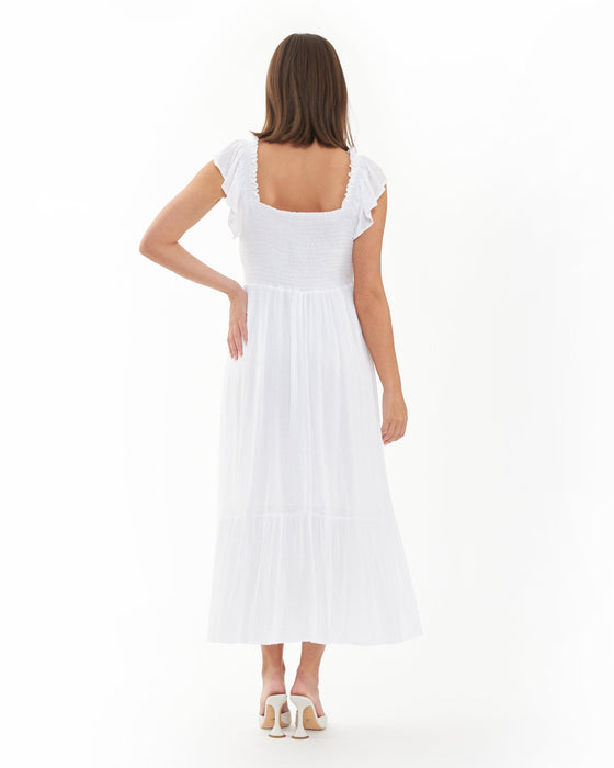 Woman wearing a white pregnancy dress on a white background