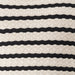 Close-up of a textured fabric with black and white stripes