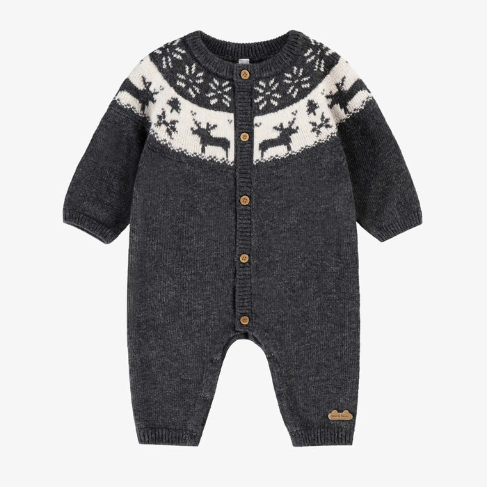 Knitted baby romper with reindeer pattern on a white background