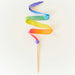 Colorful rainbow silk ribbon on a wooden wand set against a white background