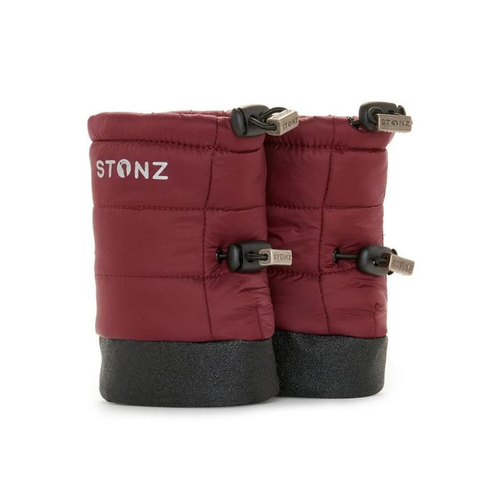 Red baby booties with black soles on a white background, featuring the Stonz brand.