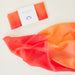 Orange silk square with a label 'Mini Playsilk' on a light background