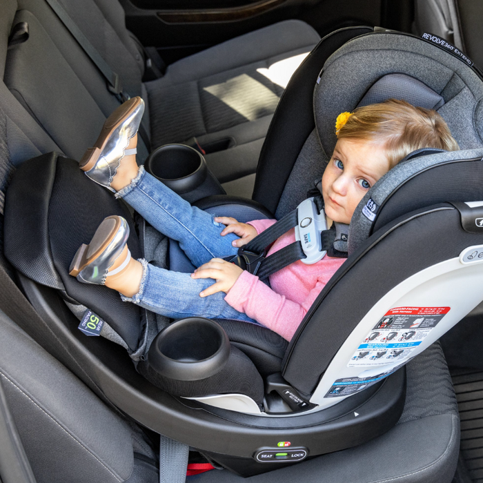 caption-Child sits in Revolve360 Extend Gold in Rear Facing position