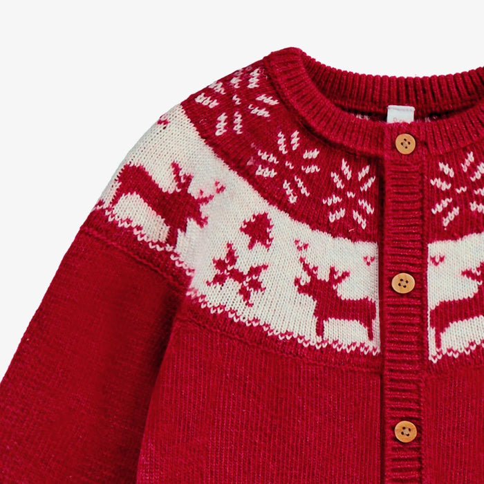 Red sweater with white reindeer pattern on a white background