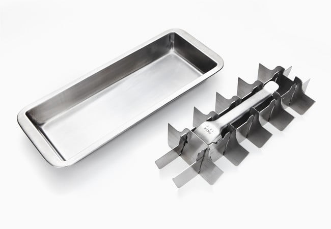 Stainless steel kitchen tool set with a rectangular tray and multiple prongs on a white background