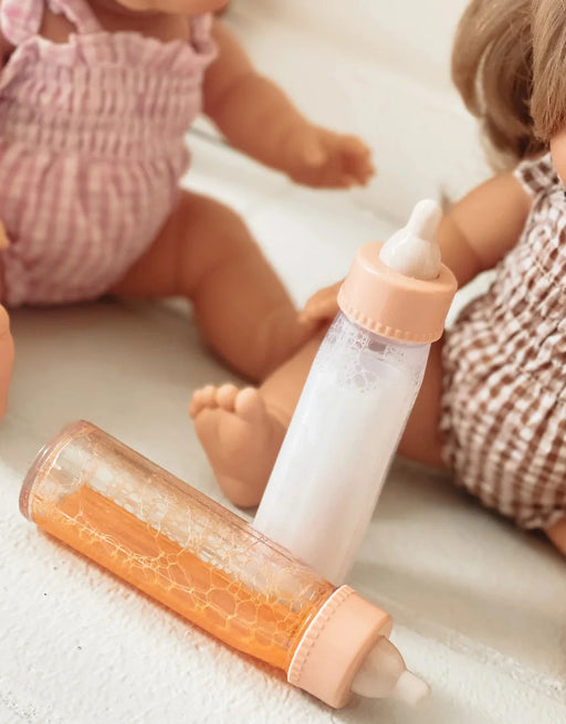 caption-Baby Doll bottles are a fun size for playtime