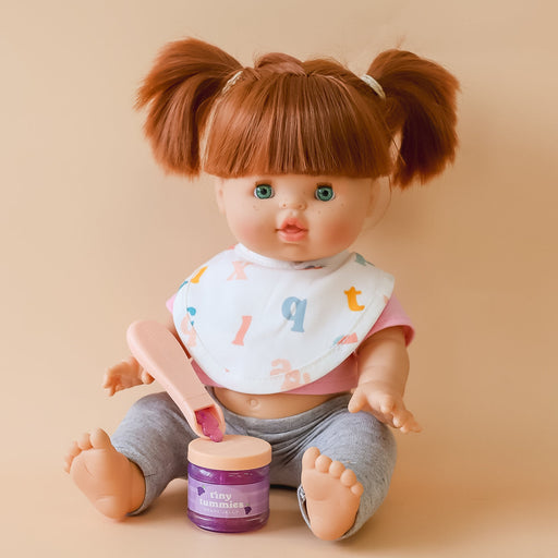 caption-Baby Doll with magic spoon and grape jar
