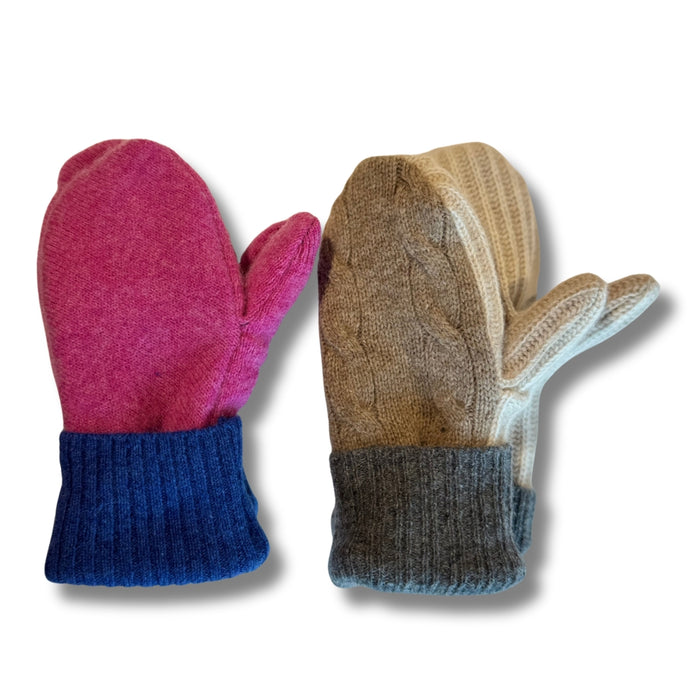 Pair of pink and blue mittens and brown and gray mittens on a white background