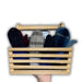 Wooden crate holding pairs of mittens on a white background