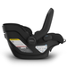 Black UPPAbaby infant car seat with visible branding and carry handle moved forward on a white background
