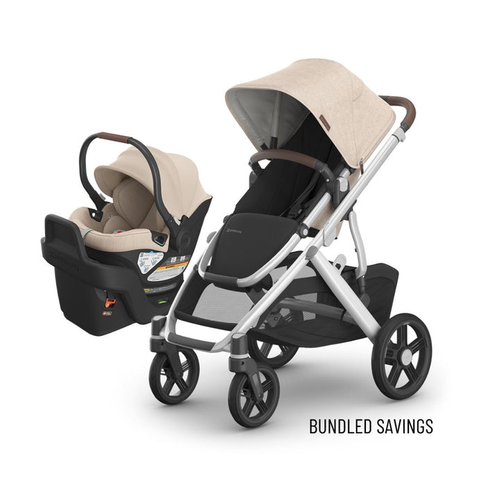 Baby stroller and car seat set with beige canopy on a white background