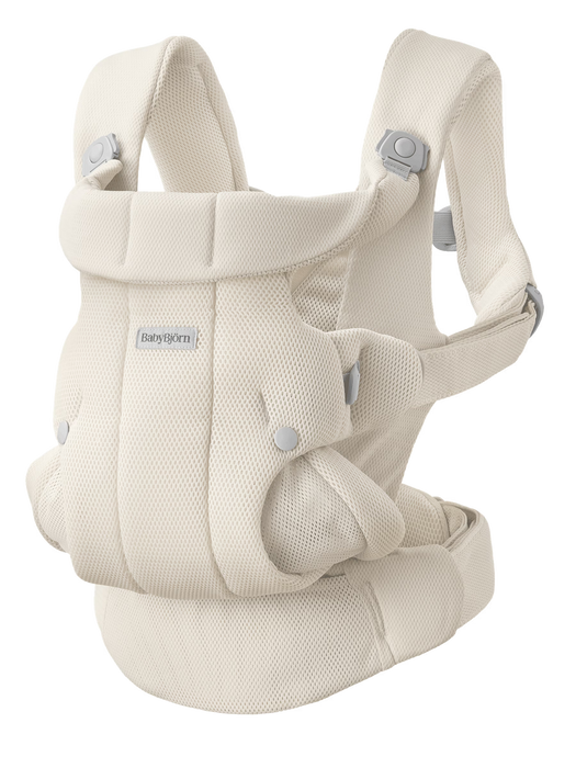White mesh baby carrier with buckles on white background with Baby Bjorn logo on front. 