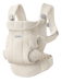 White mesh baby carrier with buckles on white background with Baby Bjorn logo on front. 