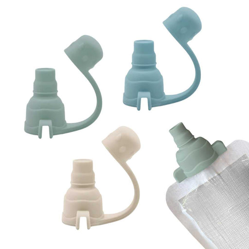 Set of three silicone bottle caps in different colors on a white background