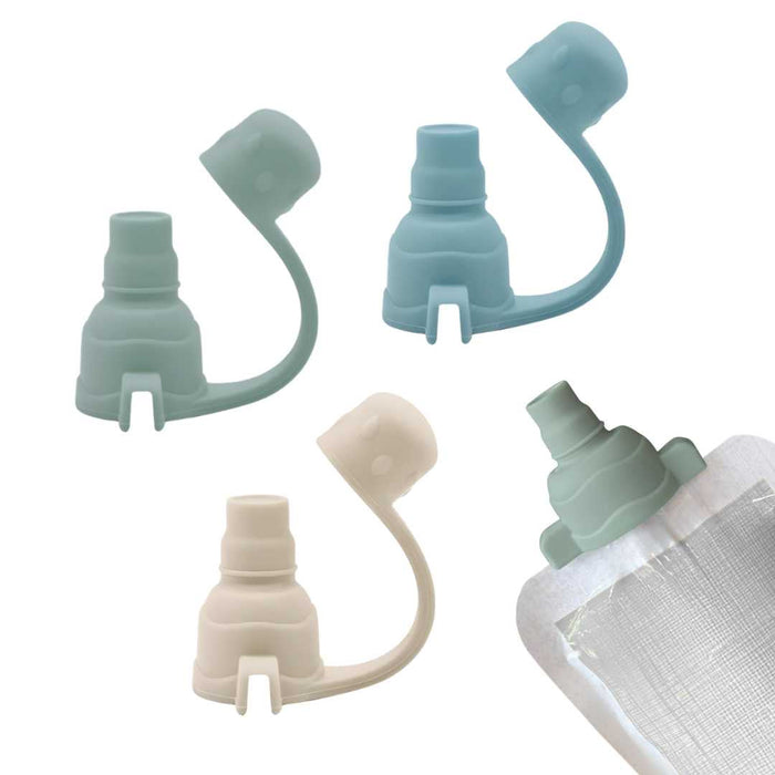 Set of three silicone bottle caps in different colors on a white background