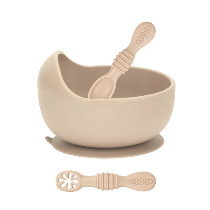 Beige bowl, spoon, and suction cup on a white background