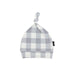 Plaid patterned baby hat with a knot on a white background
