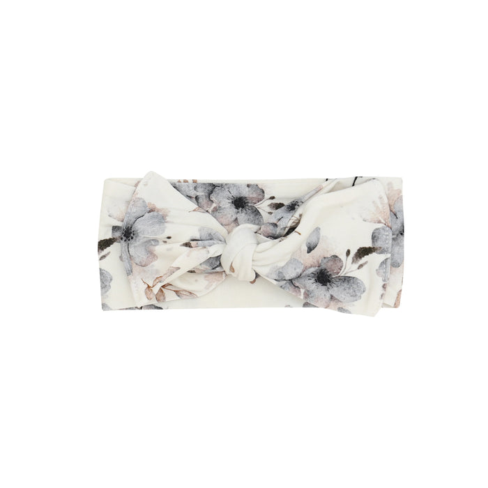 Floral patterned infant headband on a white background