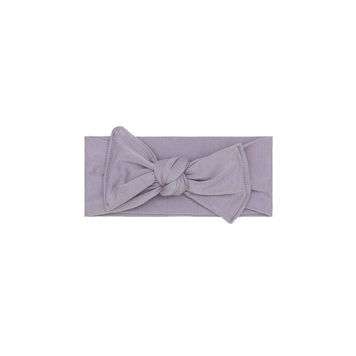 Purple headband with a knot on a white background
