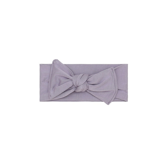 Purple headband with a knot on a white background