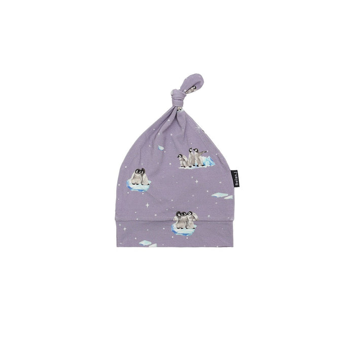 Purple baby hat with penguin design on a white background