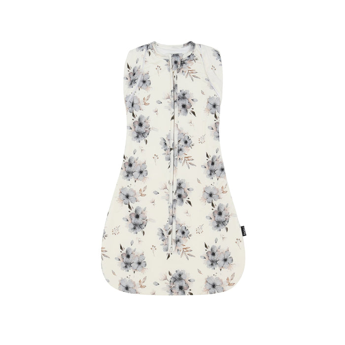 Floral patterned baby swaddle bag on a white background