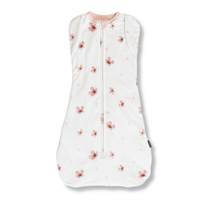 Baby sleeping bag with floral pattern on a white background