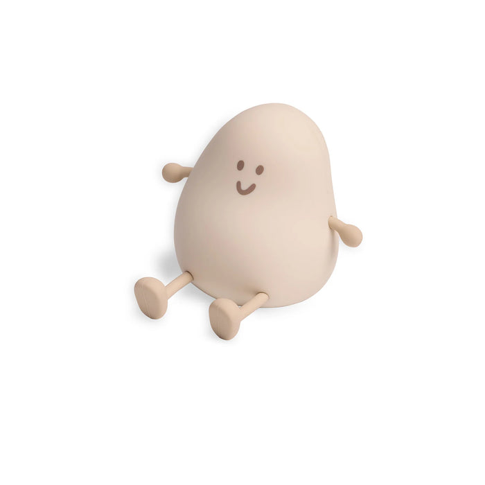 Soft egg-shaped nightlight toy with a smiling face on a white background