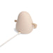 A minimalist night light in a beige color, featuring a power cord plug extending from the bottom, shown against a solid white background.