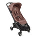 Dusky Pink baby travel stroller with black frame on a white background
