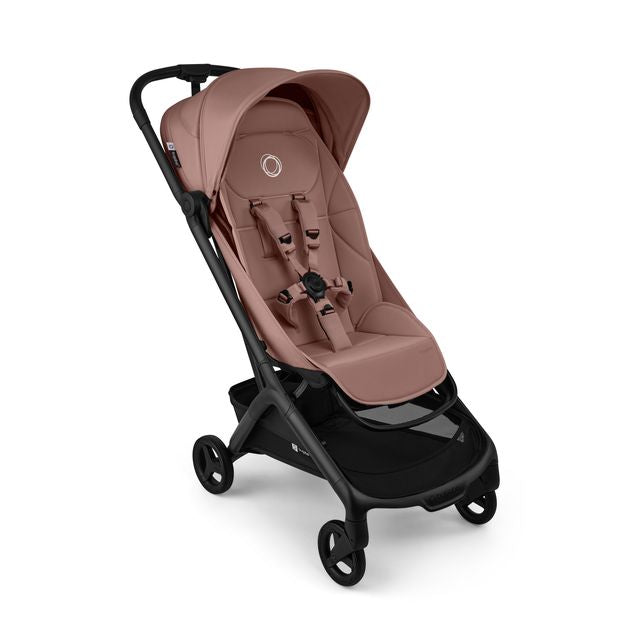 A modern pink Bugaboo stroller shown from a three-quarters angle against a plain white background.