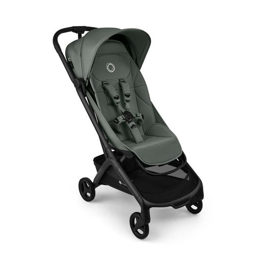 A modern stroller in forest green and black, shown from a three-quarters angle against a plain white background.