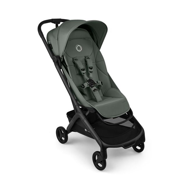 A modern stroller in forest green and black, shown from a three-quarters angle against a plain white background.