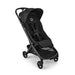 A black stroller with a matching canopy and four-wheel design, photographed from a three-quarters angle on a clean white background.