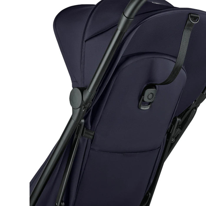 Navy blue stroller with black handlebar on a white background