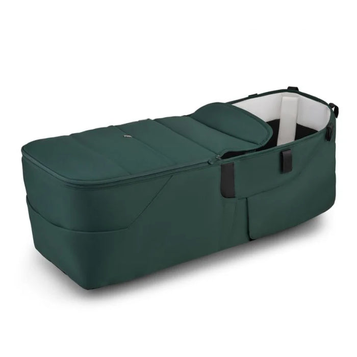 Green baby stroller bassinet on a white background