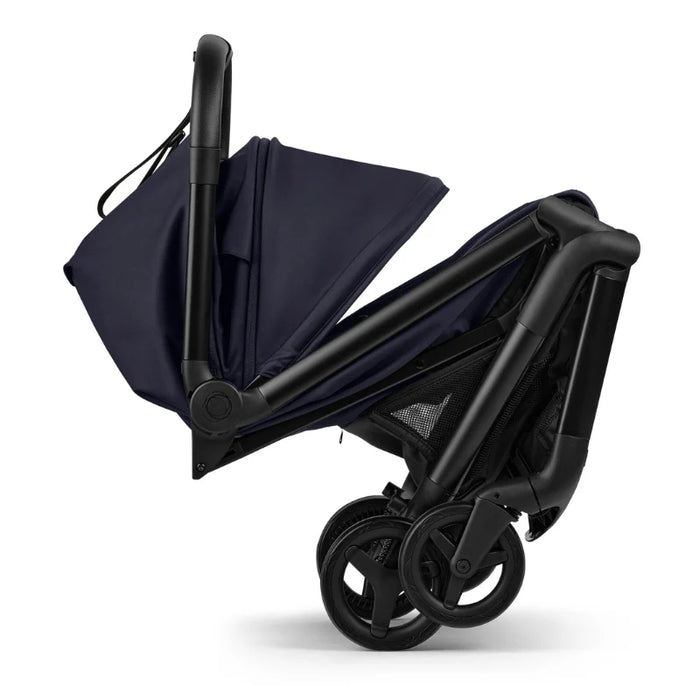 Black stroller with navy rain cover on a white background