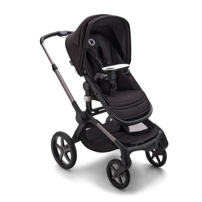 Black stroller shown with on a white background with snack tray (sold separately)